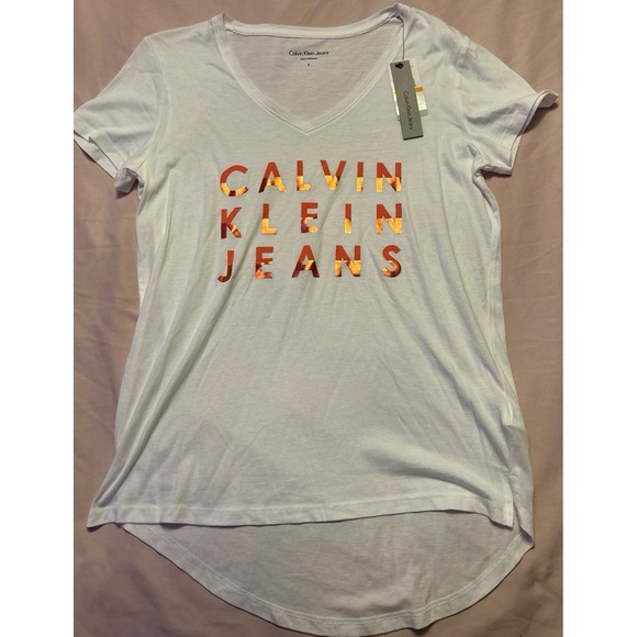 Calvin Klein Tops - NEW Calvin‎ Klein Jeans Women's White Metallic Logo High Low Tee, Small